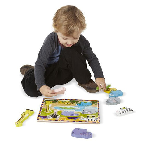 Child putting puzzle together.