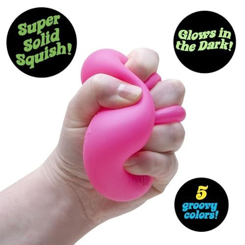 Hand squeezing NeeDoh Nice Cube Glow squishy toy 