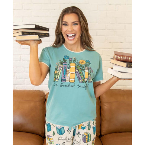 Woman wearing Lazy One Booked women's pajama tee shirt