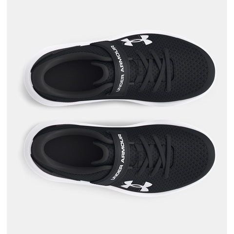 Overhead view of Under Armour boy's Surge 4 shoes in black & white