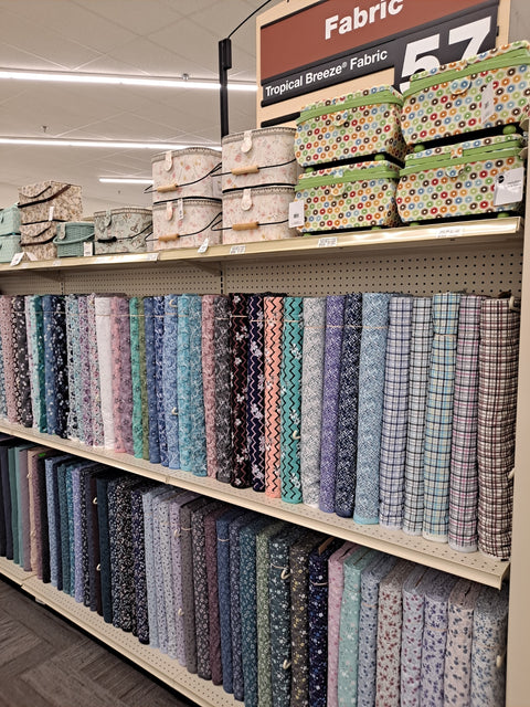 Bolts of Tropical Breeze Fabric and sewing baskets
