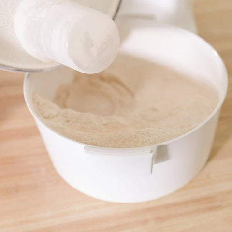 Flour coming out of NutriMill Classic Grain Mill